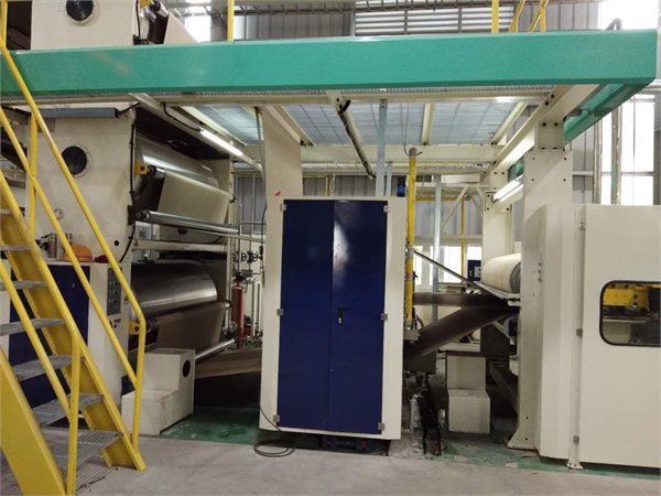 Corrugated glue applicator in a production line