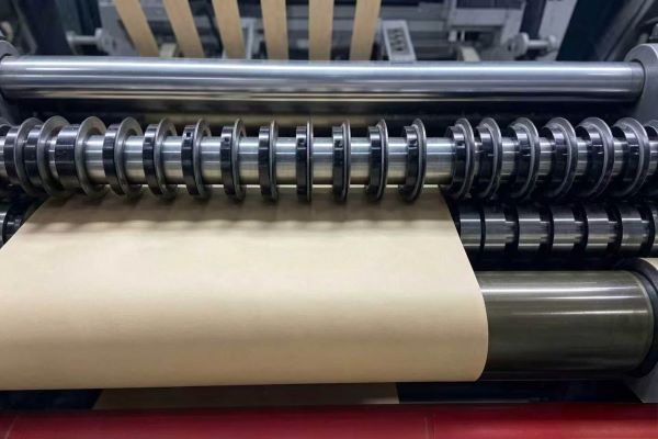 Corrugated board passing through feeding rollers