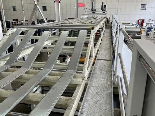 Corrugator bridge guide rails and conveyor belts.